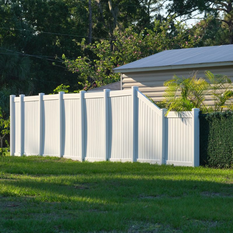 White plastic fence for back yard protection and privacy